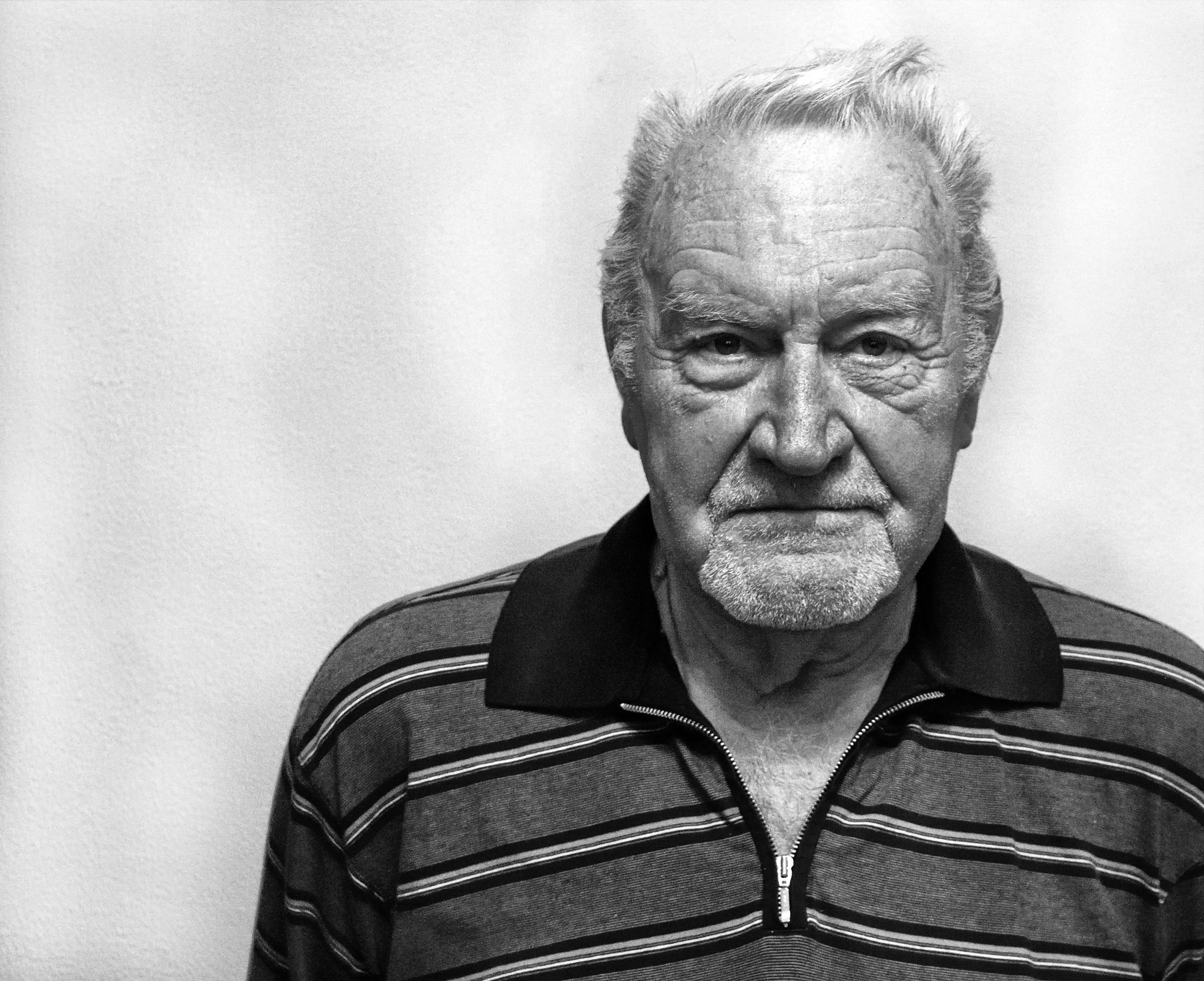 Grayscale Photography of Man Wearing Polo Shirt